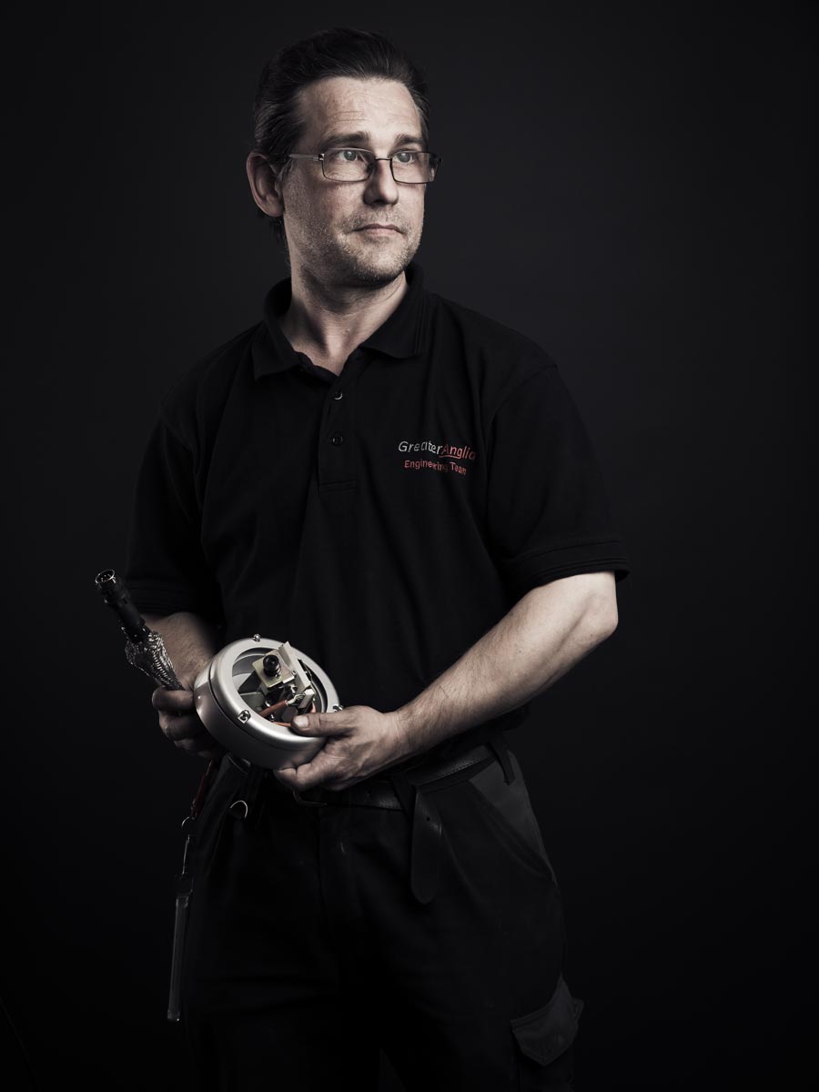 Portrait of man holding tool