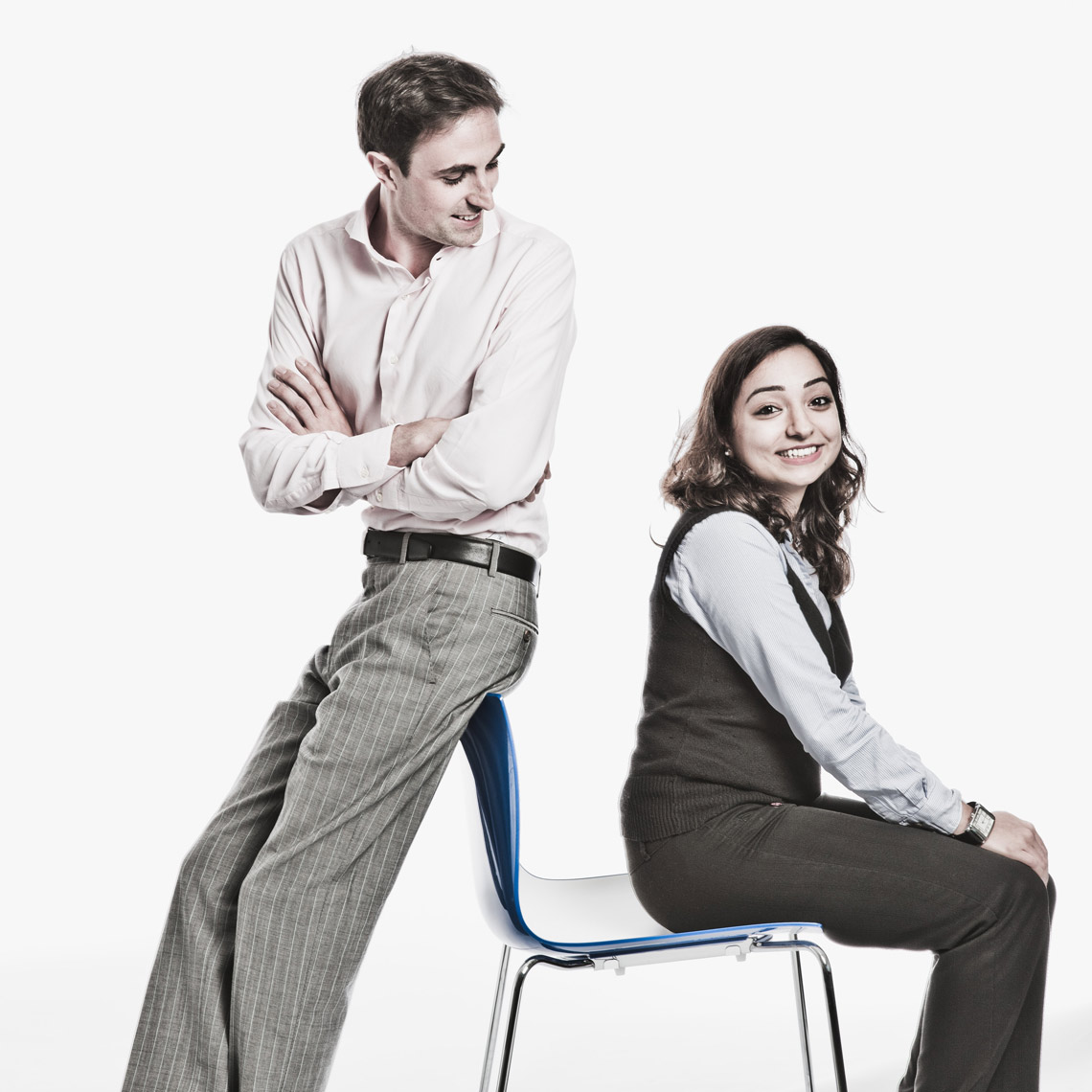 Man and woman sitting on chair