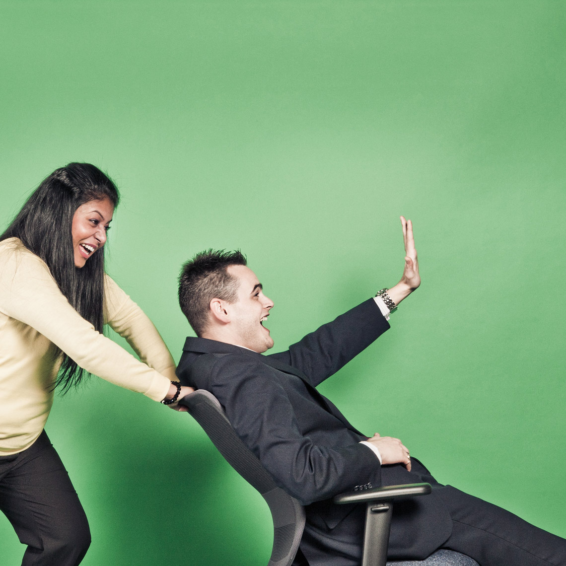 woman pushing man in chair
